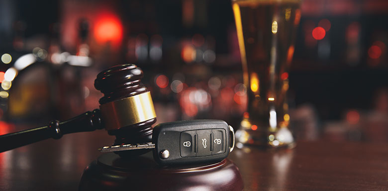 Car-Keys-Surrounded-by-A-Glass-of-Beer-and-a-Gavel